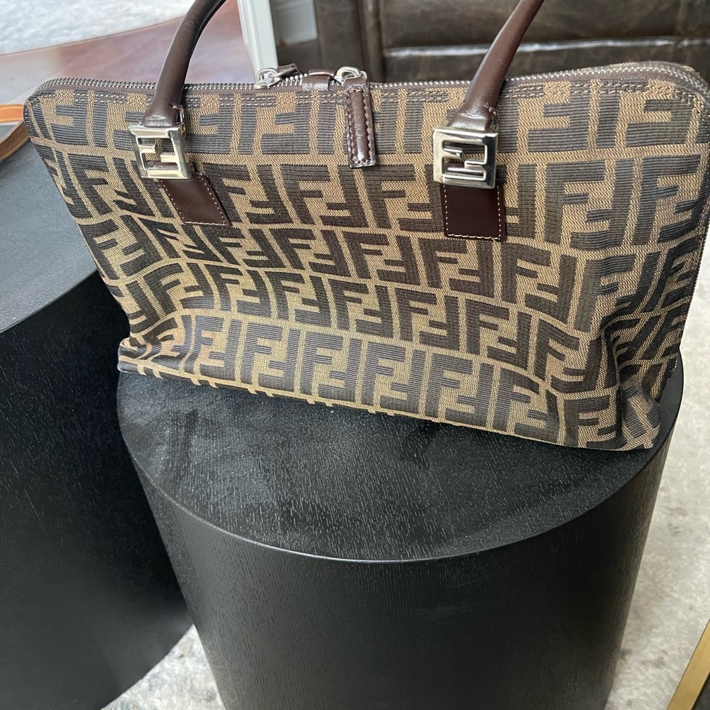 Fendi bag is in very good condition . The inside and out is clean.